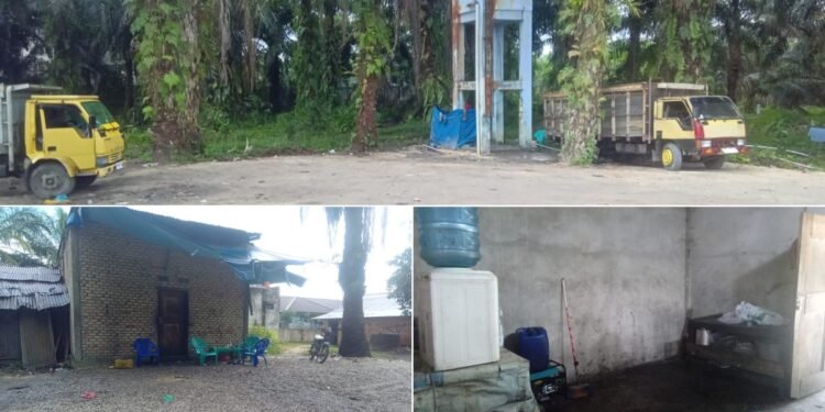 Kondisi gudang di Desa Lubuk Sakat Kecamatan Perhentian Raja yang diisukan menjadi tempat penimbunan BBM ilegal Pemilik menyatakan lokasi ini hanya digunakan sebagai tempat parkir dan bengkel truk sawit